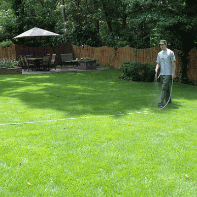 Daniel spraying compost tea on zeon zoysiagrass 800x435